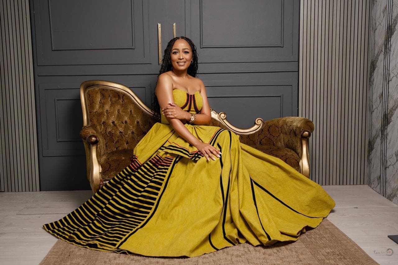 Zukiswa Silinga seated in traditional umbhaco, host of The CEO's Table